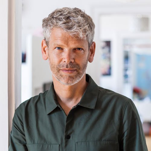 testi portrait of mature man with grey hair and stubble