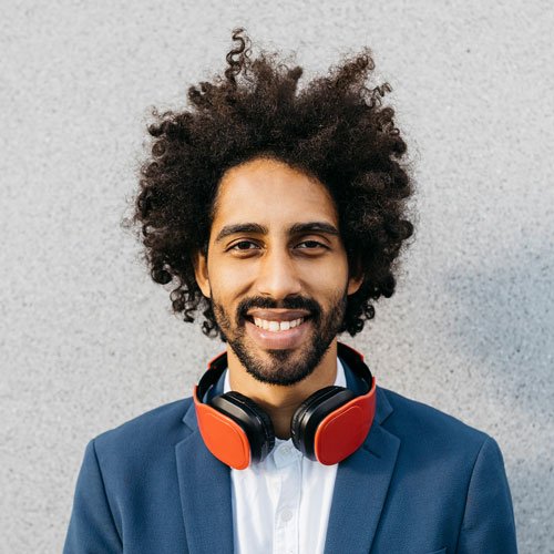 testi portrait of smiling young businessman with headph